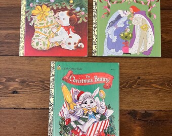 May include: Three vintage children's books with vibrant covers. Titles include "The Poky Little Puppy's First Christmas," "The Twelve Days of Christmas," and "Christmas Bunny." The books feature illustrations of a puppy, carolers, and a bunny in a festive setting.