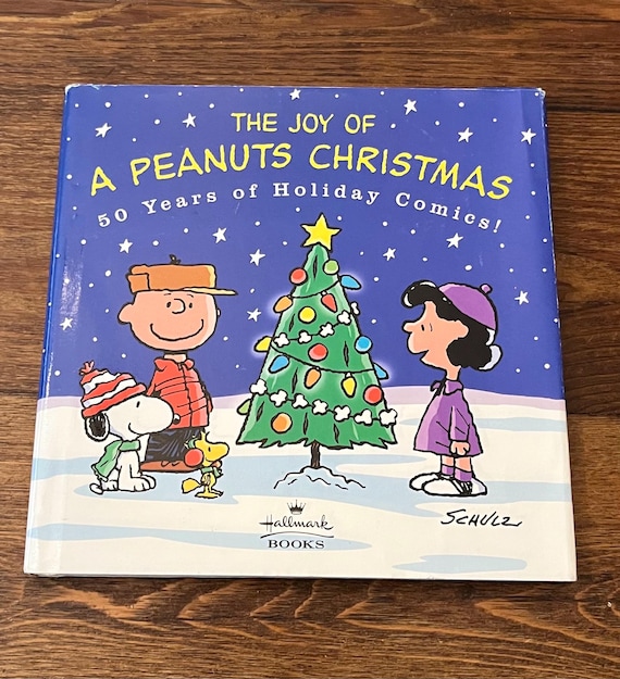 洋書 50years ofChristmasTables The Joy of A Peanuts Christmas, 50 Years of Holiday Comics by