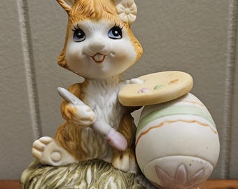ヴィンテージ 1980 年代 茶色と白のウサギがイースターエッグを描いて