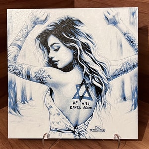 May include: A blue and white illustration of a woman with long hair and tattoos. She is wearing a white dress and has a Star of David tattoo on her back. The text "We will dance again" is written below the tattoo. The artist's name, "Ron Yishai-evich", is written in the bottom right corner.