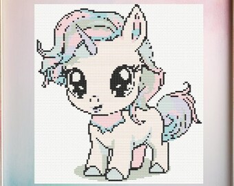 May include: A cross-stitch pattern of a cute cartoon unicorn with a pink, blue, and white mane and tail. The unicorn has large, black eyes and a pink nose. The pattern is framed in a white frame.