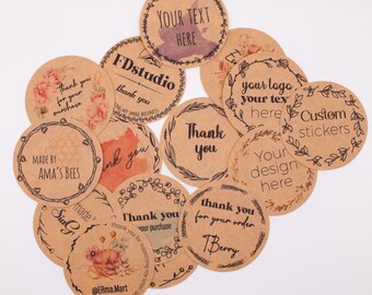 May include: A collection of round, kraft paper stickers with various designs and text. Some stickers feature floral accents, while others have phrases like "Thank You" and "Your Text Here." The stickers are suitable for small business branding.