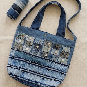 May include: A trio of ceramic mugs with a speckled, matte finish in light blue, cream, and grey. The mugs have a simple, modern design with a rounded shape and a comfortable handle. Ideal for tea or coffee.