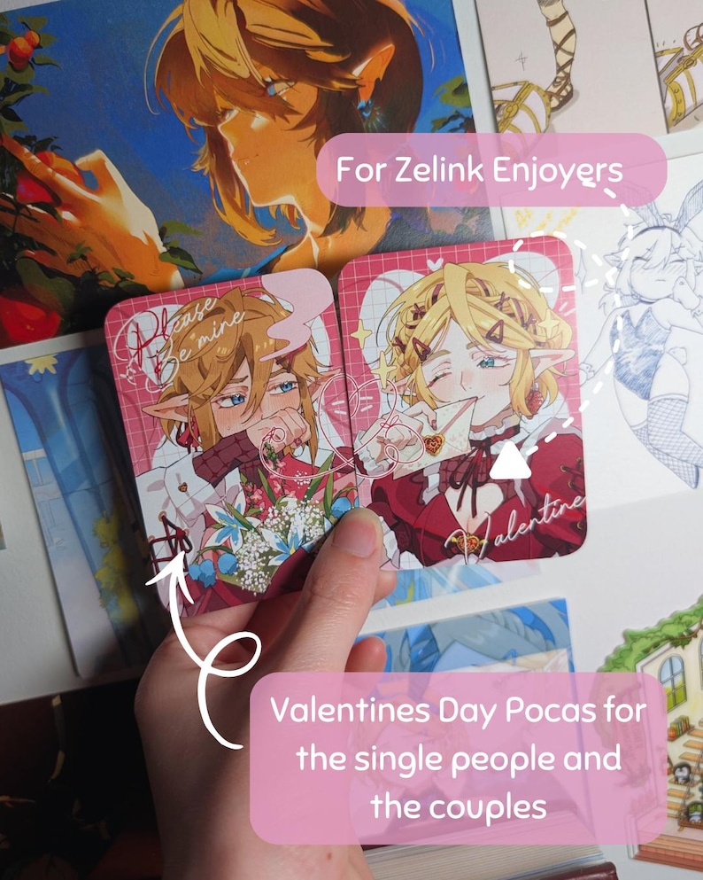 May include: Two Valentine's Day cards featuring anime-style illustrations of characters with blonde and brown hair, red and white outfits, and the text "Please Be Mine" and "Valentine". The cards are held in a hand, with the text "Valentines Day Pocas for the single people and the couples".