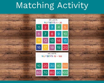 May include: A numbers matching activity set featuring two white rectangular cards with colorful square tiles. The top card displays numbers 1-20, and the bottom card displays numbers 10-100 in increments of ten. Each card includes the text Let's match the NUMBERS.
