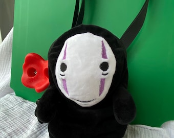 Kaonash No-face man climbing chalk bag