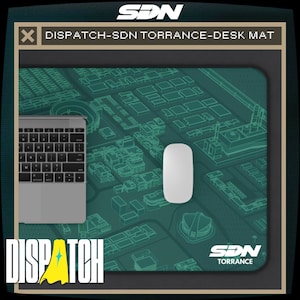 May include: A desk mat with a teal map design, a laptop, and a white mouse. The mat has the text "DISPATCH-SDN TORRANCE-DESK MAT" and the "DISPATCH" logo. The mouse is approximately 4 inches long.