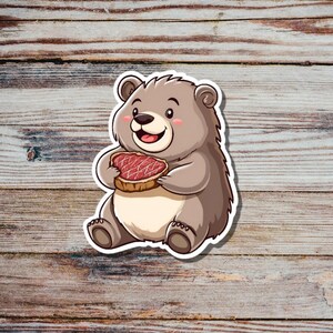 Niedlicher Bär isst Steak Sticker
