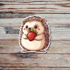 Niedlicher Igel isst Erdbeere Sticker