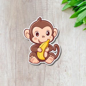 Sticker en vinyle Singe mangeant une banane