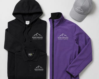 May include: A black hooded sweatshirt, a black polo shirt, a purple zip-up jacket, and a gray baseball cap. Each item features an embroidered white logo of a mountain range above the text Northridge Property Services in a clean font.