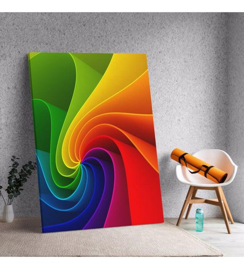 a colorful painting on a wall next to a chair