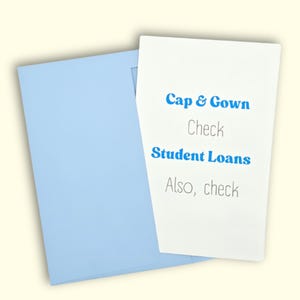 May include: A light blue envelope with a white card. The card has the words "Cap & Gown", "Check", "Student Loans", and "Also, check" printed in blue and gray.