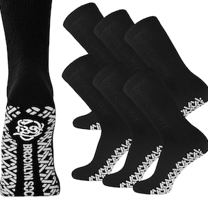 May include: A pack of five black non-slip socks with white gripper dots on the bottom. The socks have the text "Brooklyn Sock" on the bottom.