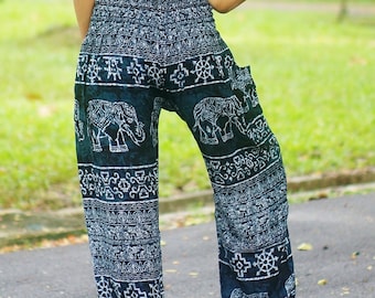 May include: Blue and white patterned pants with an elephant design. The pants are loose fitting and have a wide leg.