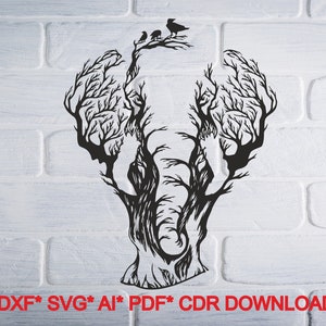 May include: Black and white silhouette of an elephant's head formed by the branches of a tree. Three birds are perched on the top of the tree.