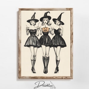 May include: Three witches in black dresses and pointy hats holding glasses and a jack-o-lantern. The witches are drawn in black and white with orange accents on the pumpkin.