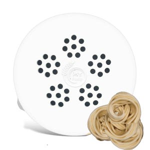 May include: White plastic pasta maker attachment with a flower-shaped design and black holes. A pile of fresh, light brown pasta noodles is in the foreground.