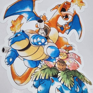 May include: A sticker featuring four Pokemon characters: Charizard, Blastoise, Venusaur, and Bulbasaur. Charizard is breathing fire, Blastoise is firing water cannons, and Venusaur is standing on a green plant. The sticker is on a white background.