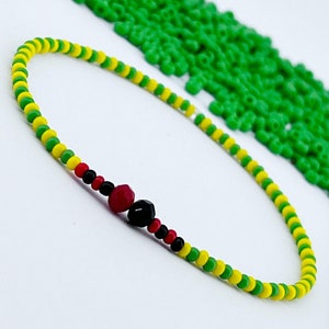 Ilde Orula camino Elegua / Orunmila camino Eleggua, Brazalete religioso elastico