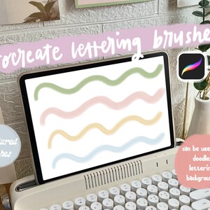 May include: A digital illustration of four textured brushes for Procreate, shown on a laptop screen. The brushes are used to create wavy lines in green, pink, yellow, and blue. The text "Procreate lettering brushes" is written in a handwritten font on a purple background. The text "4 textured brushes" is written in a white circle on a light blue background. The text "can be used for doodles, lettering & backgrounds!" is written in a white circle on a pink background.