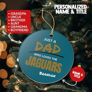 May include: A round teal Christmas ornament with gold text that reads JUST A DAD WHO LOVES THE JAGUARS and the name BRANDON. The ornament features a gold hanging string and is displayed with text options for personalized name and title.