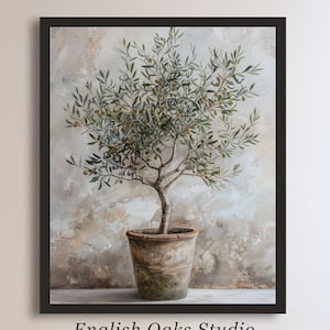 May include: A painting of a small olive tree in a terracotta pot against a textured, light gray background. The tree has green leaves and small green olives. The painting is framed in black.