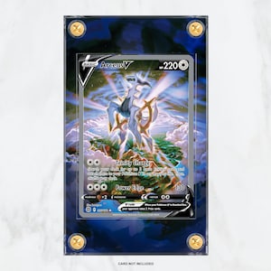 May include: A Pokemon trading card featuring Arceus V, a legendary Pokemon with a blue, white and gold design. The card is numbered 220 and has a power edge attack that does 130 damage.