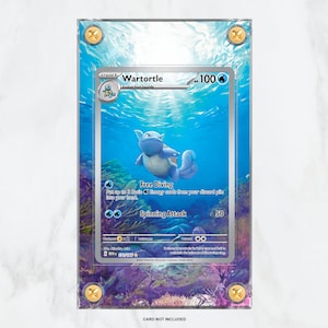 May include: A clear plastic slab case with a blue and white Pokemon card inside. The card features Wartortle, a blue turtle Pokemon with a white shell. The card is from the Pokemon Trading Card Game. The case has a gold border and a gold sticker with the words "SLAB CITY".