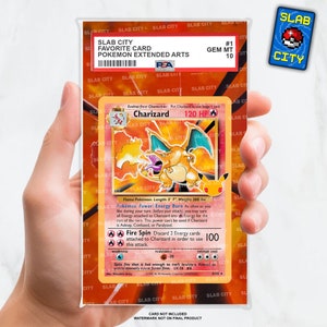 May include: A graded Pokemon card in a protective plastic case. The card is a Charizard from the Pokemon Trading Card Game. The card is graded Gem Mint 10 and is in a clear plastic case with a red and black label that says "Slab City Favorite Card Pokemon Extended Arts".