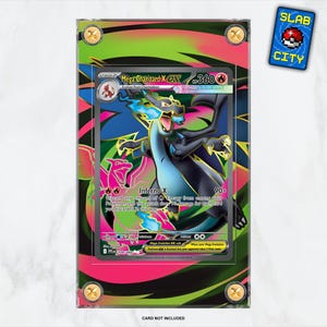 May include: A framed Mega Charizard X EX trading card. The card features a dragon illustration with blue, black, and orange hues. The frame has a neon green and pink design with gold-colored corner accents. A "SLAB CITY" sticker is in the upper right corner.