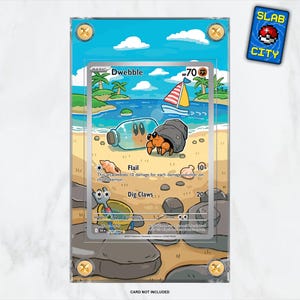 May include: A Dwebble Pokémon card in a clear protective case, depicting a beach scene with a sailboat and a hermit crab. The card has a blue sky background and the text "SLAB CITY".