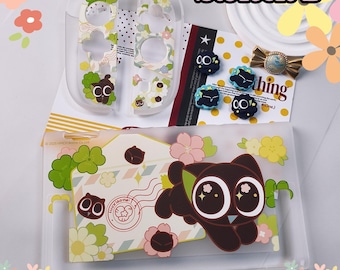 Conjunto de accesorios para juegos de Switch 2 con diseño floral de gato negro, funda para mando y agarres para los pulgares.
