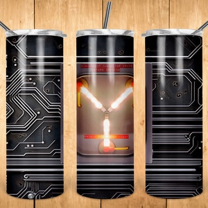 May include: A stainless steel tumbler with a black and silver design featuring a circuit board pattern and a close-up of the flux capacitor from the movie Back to the Future. The text on the flux capacitor reads "DISCONNECT CAPACITOR DRIVE BEFORE OPENING".