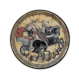 May include: A round ceramic plate featuring a black and white design of a winged chariot drawn by two horses. The chariot is being driven by a figure holding a spear. The plate has a decorative border of a repeating geometric pattern.