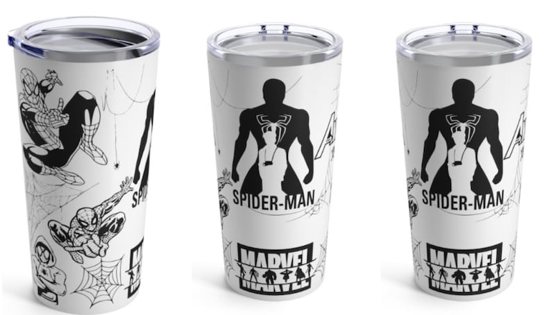 May include: A white stainless steel tumbler with a black and white design featuring Spider-Man. The tumbler has a black lid and a black and white Marvel logo at the bottom.