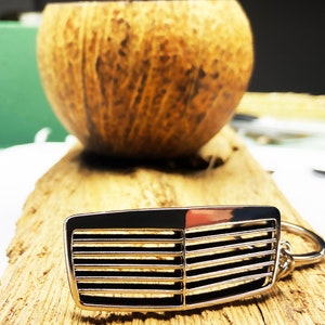 Porte-clés pour calandre Mercedes-Benz W210/211