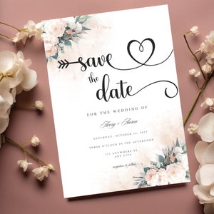 Könnte beinhalten: Save the date Hochzeitseinladung mit floralem Design und einem herzförmigen Pfeil. Die Einladung ist für Avery und Haren, und die Hochzeit ist für Samstag, den 14. Oktober 2025 um 15:00 Uhr geplant. Der Empfang folgt.