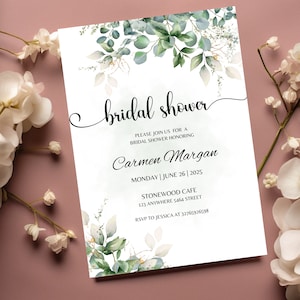 May include: A white bridal shower invitation with green watercolor leaves and the text "bridal shower" in cursive. The invitation includes the bride's name, Carmen Margan, the date and time of the shower, and the location, Stonewood Cafe. It also includes the address and RSVP information.