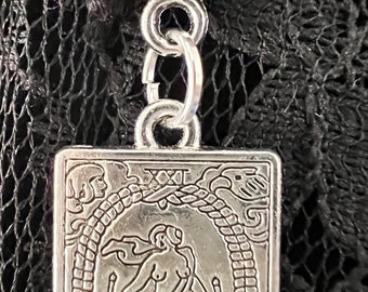 The Paranormal World Tarot Card Pendant Necklace with a celestial starry crescent moon charm dangling down the back of your neck