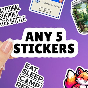 May include: A white sticker with black text that says "ANY 5 STICKERS". The sticker is being held by a hand. There are other stickers in the background, including one that says "EMOTIONAL SUPPORT WATER BOTTLE" and another that says "EAT. SLEEP. CAMP. REP."