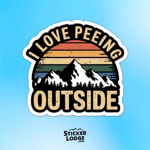 May include: A sticker with a mountain and sunset design. The text reads "I LOVE PEEING OUTSIDE" in a retro font. The sticker has a white border and a blue background.