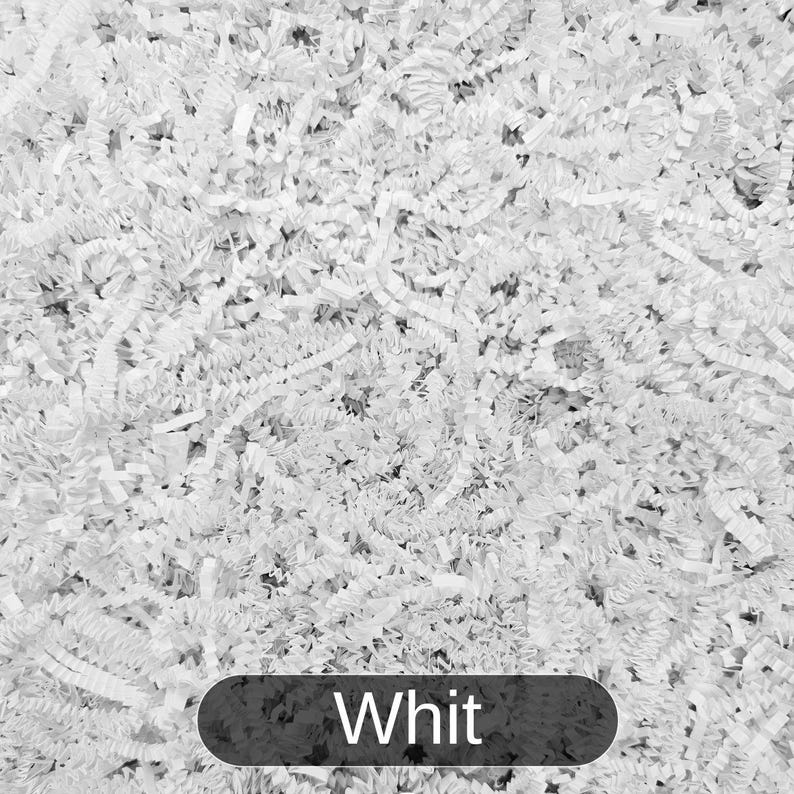 May include: White shredded paper, commonly used as packing material for gifts and fragile items.