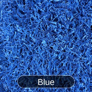 May include: Blue shredded paper, a popular choice for gift wrapping and packaging.