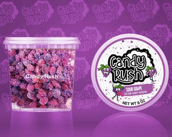May include: A clear plastic container filled with sour grape cotton candy gushers, next to a round container with the "Candy Rush" logo and "Sour Grape" text. The background is a purple gradient with the "Candy Rush" logo.