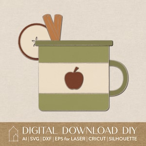 May include: A green mug with a white stripe and an apple design. The mug has a handle and is decorated with cinnamon sticks and an apple slice.
