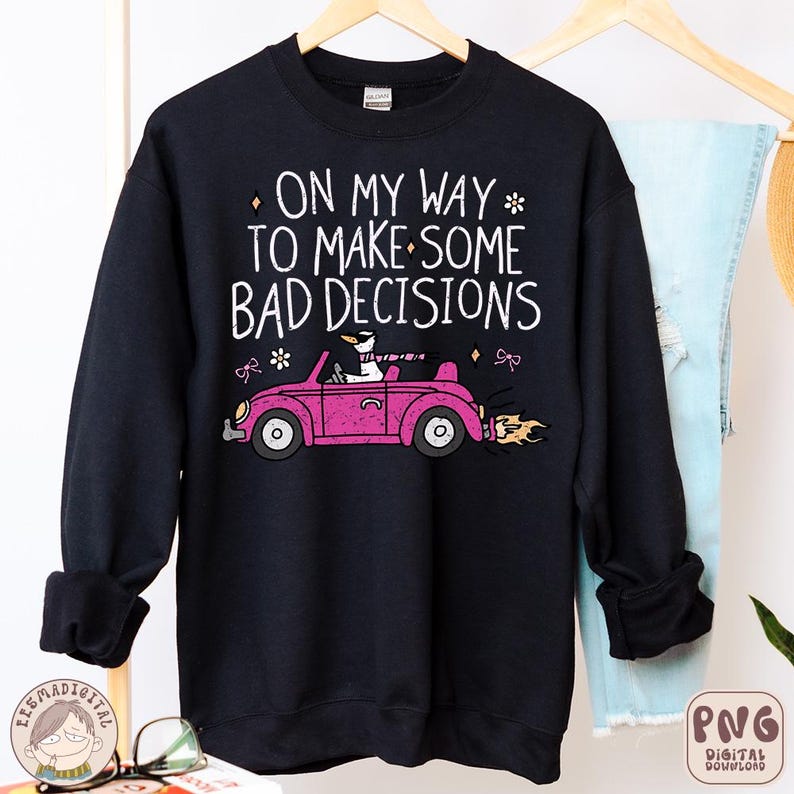 May include: Black sweatshirt with a white graphic of a pink car with a cartoon animal driving. The text on the graphic reads "On my way to make some bad decisions."