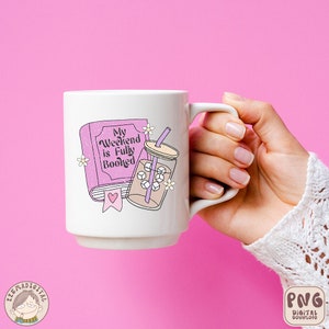May include: White ceramic mug with a pink book and a mason jar with a straw and ice cubes. The text on the book reads "My Weekend is Fully Booked".