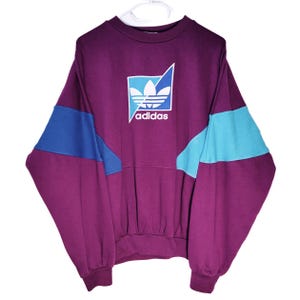 Sudadera Adidas vintage de los 90, color morado, bloques de color, trébol, cuello redondo, estilo retro oversize, ropa urbana unisex / Talla S/M