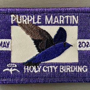 May include: Purple embroidered patch with a purple martin bird, the text "Purple Martin", "May 2024", and "Holy City Birding".